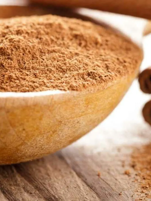 cinnamon powder in a wooden bowl