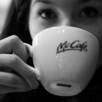 a girl drinking McDonald's coffee